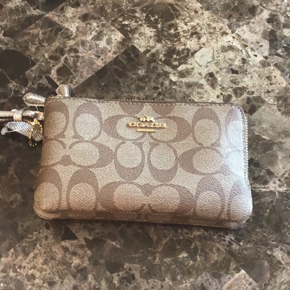 New Coach wristlet. Never been used.